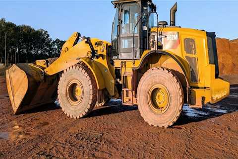 Building With Nature: The Synergy Of Skid Loader Tree Pullers And Natural Stone Materials